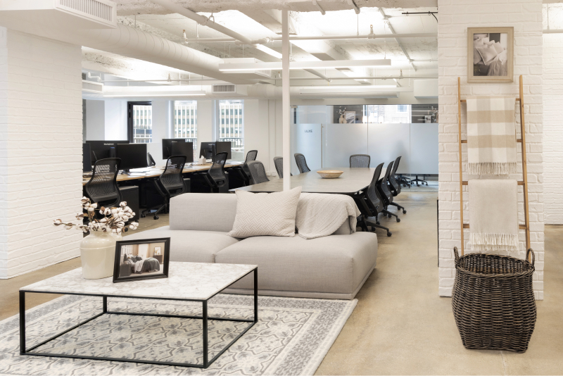 new york office interior waiting area with table and couch