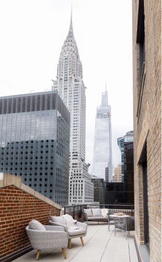 new york office patio area with skyscraper in background