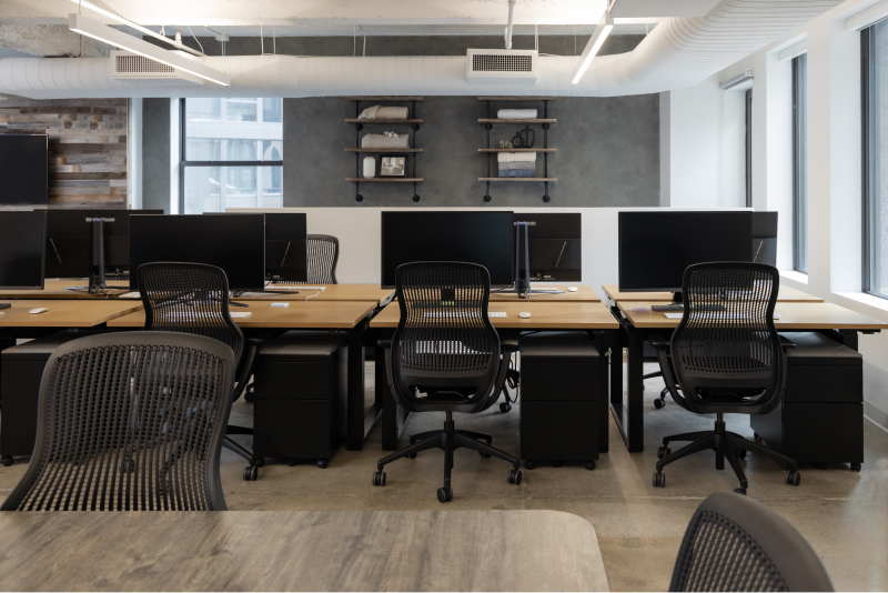 new york office interior communal work are with monitor and chairs