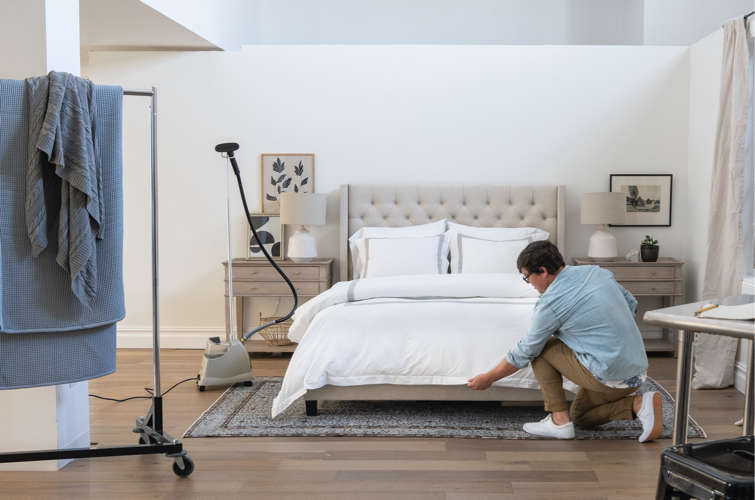 man making bed
